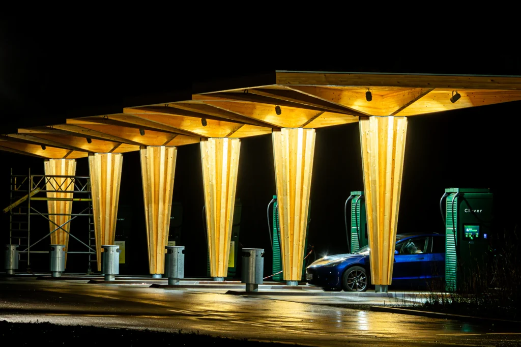 Illuminated commercial EV charging hub at night