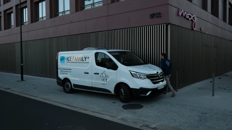 White van parked beside a commercial building