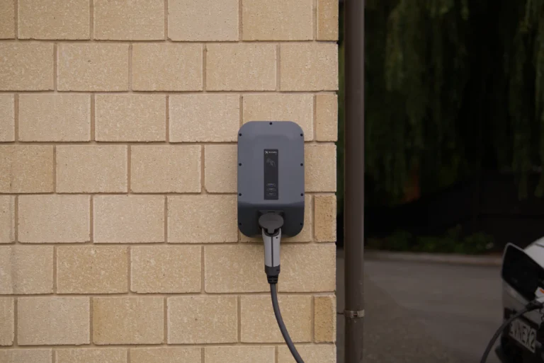 Wall-mounted EV charger with cable connected