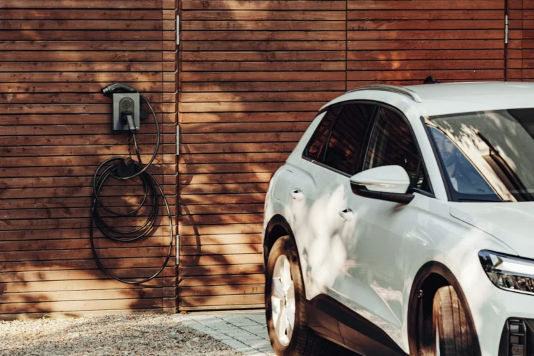 Electric car charging on a home driveway